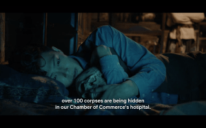 Ding Mao cuddles with a skull